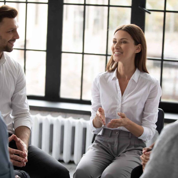 Confident,Smiling,Woman,Coach,Speaking,At,Meeting,,Happy,Diverse,People